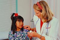 Picture of a female physician talking to a young female patient